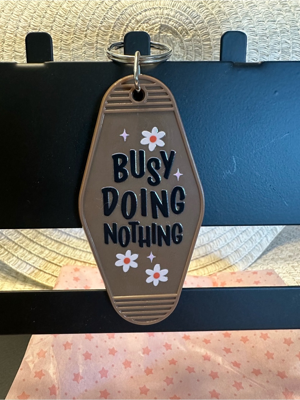 "Busy Doing Nothing" Brown Motel Keychain